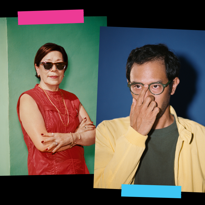 Two pairs of glasses, one tortoise-shell and one black, are hanging and overlapping on a green background.