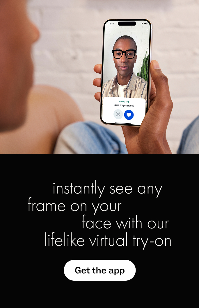 Man virtually tries on glasses using a phone app that shows frames on his face.