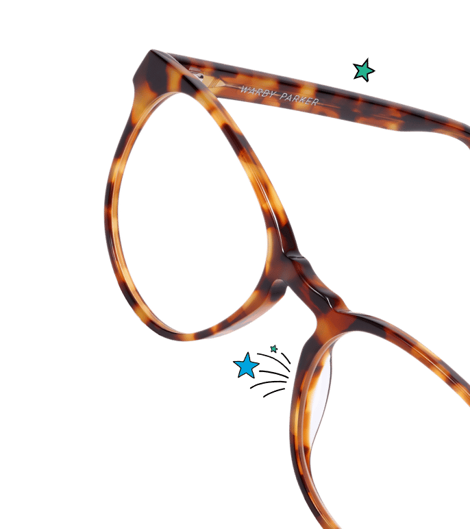 Tortoise-shell Warby Parker eyeglass frames with a rounded cat-eye shape, angled side view.