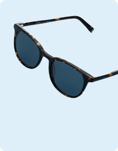 Black sunglasses on a light blue background.